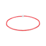 Pink beaded choker necklace on a white background. Available at Be Charmed