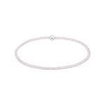 Silver bracelet with a single bead on a white background. Available at Be Charmed