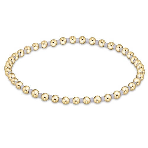 enewton Hope Grateful Bracelet in Blue Ice – gold-filled 2mm bead bracelet with icy blue gemstones. Available at Be Charmed.