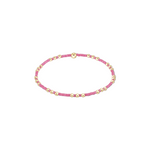 Pink beaded bracelet with gold beads on a white background. Available at Be Charmed