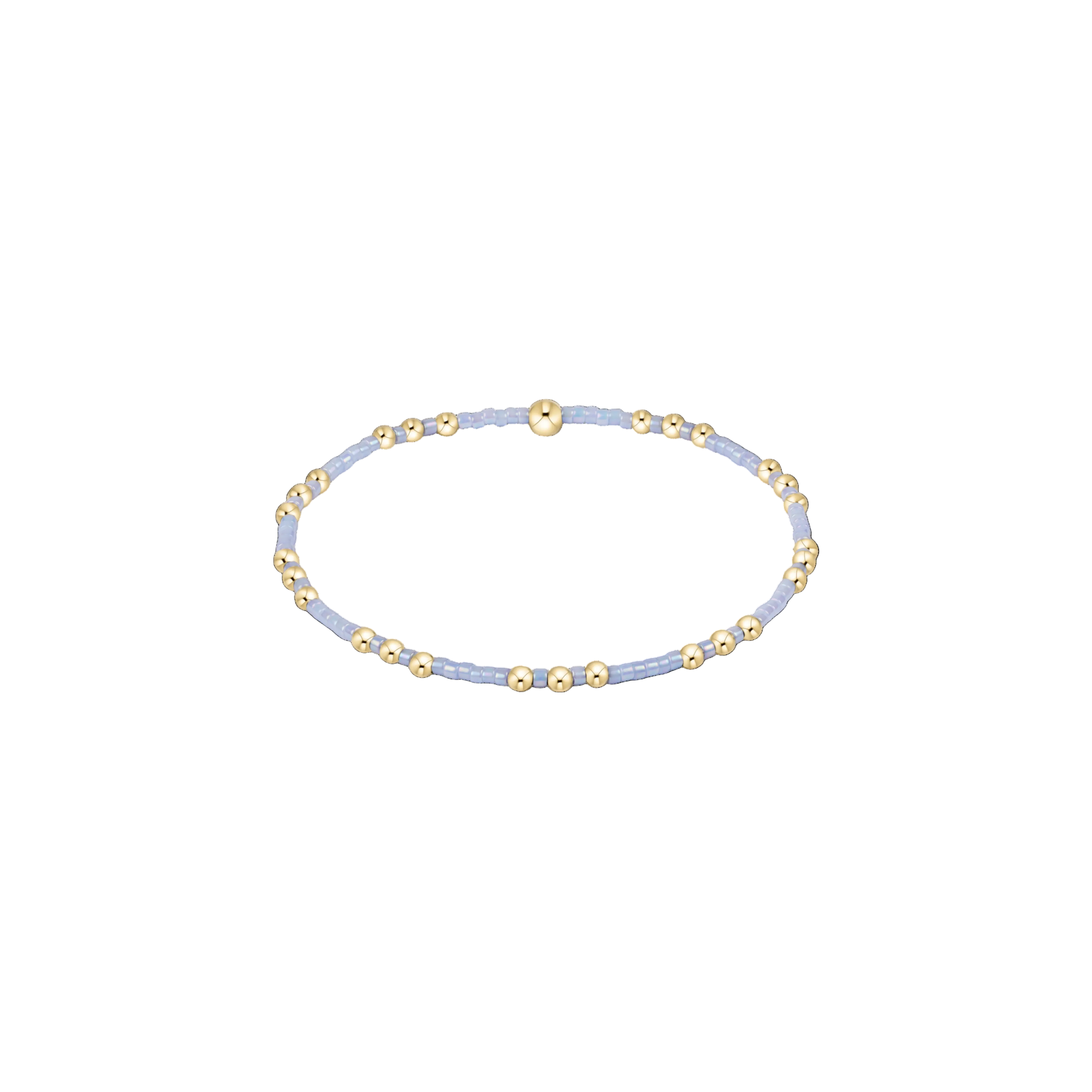 Delicate bracelet with gold and light blue beads on a white background. Available at Be Charmed