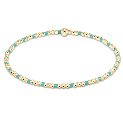 enewton Hope Sincerity Pattern 2mm Bead Bracelet in Turquoise with 14k gold-filled and turquoise-accent beads. Stackable and water-friendly. Available at Be Charmed.