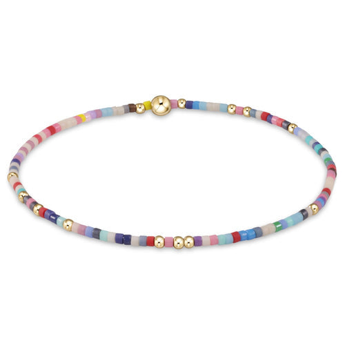 enewton Hope Unwritten Bracelet – Hot Mess with vibrant pink beads and 14k gold-filled accents. Stretchy, stackable, and water-friendly. Available at Be Charmed.