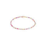 Beaded bracelet with pink, gold, and white beads on a white background. Available at Be Charmed