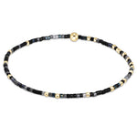 enewton Hope Unwritten bracelet in “Nothin’ Good After Midnight” dark tones; bold, moody, and stretch-fit. Available at Be Charmed.