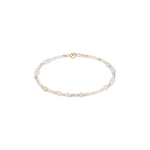 Pearl and gold beaded bracelet on a white background. Available at Be Charmed