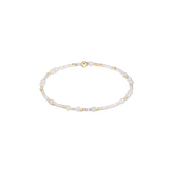 Pearl and gold beaded bracelet on a white background. Available at Be Charmed
