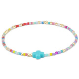enewton Hope Unwritten Signature Cross Bracelet in Hot Mess with 14k gold-filled beads and cross charm. Meaningful, stackable, and water-friendly. Available at Be Charmed.