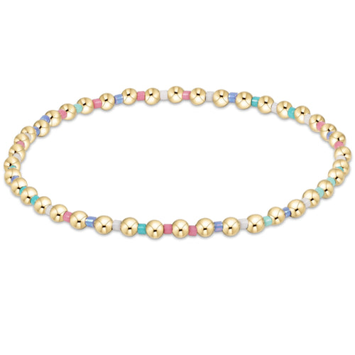 enewton Hope Grateful Bracelet – Hot Mess SS25 with multicolor 2mm seed beads and 2mm 14kt gold-filled beads on stretch elastic. Worry-free wear: sleep, shower, sweat. Stylish and stackable. Available at Be Charmed