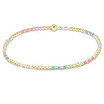 enewton Hope Joy Pattern 2mm Bead Bracelet – Hot Mess SS25 – featuring pastel pink, blue, and purple 2mm seed beads with 2mm 14kt gold‑filled beads on stretch elastic. Worry‑free wear—safe for sleep, shower, and sweat. Stackable and stylish. Available at Be Charmed