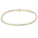 enewton Hope Joy Pattern 2mm Bead Bracelet – Hot Mess SS25 – featuring pastel pink, blue, and purple 2mm seed beads with 2mm 14kt gold‑filled beads on stretch elastic. Worry‑free wear—safe for sleep, shower, and sweat. Stackable and stylish. Available at Be Charmed