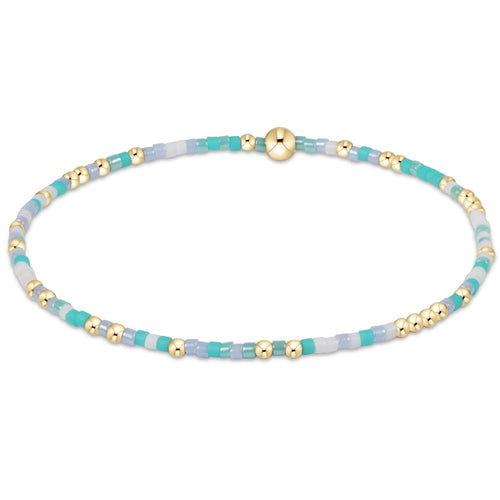 enewton Hope Unwritten “Man, I Teal Like A Woman” bracelet in vibrant teal stretch beads symbolizing bold self‑expression and hope. Available at Be Charmed.