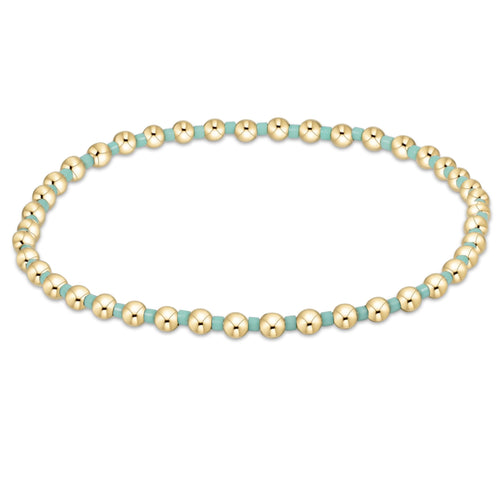 enewton Hope Grateful Bracelet – mint 2mm seed beads paired with 2mm 14kt gold-filled beads on stretch elastic. Worry-free wear: sleep, shower, sweat. Stackable and stylish. Available at Be Charmed