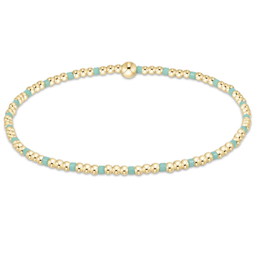 enewton Hope Sincerity Pattern 2mm Bead Bracelet in Mint with 14k gold-filled and mint accent beads. Stackable, stretchy, and water-friendly. Available at Be Charmed.