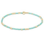 enewton Hope Unwritten Bracelet in mint—featuring mixed 2mm mint seed beads and 2mm 14 kt gold‑filled beads on high‑performance elastic for worry‑free wear (sleep, shower, sweat). Stacks beautifully. Available at Be Charmed