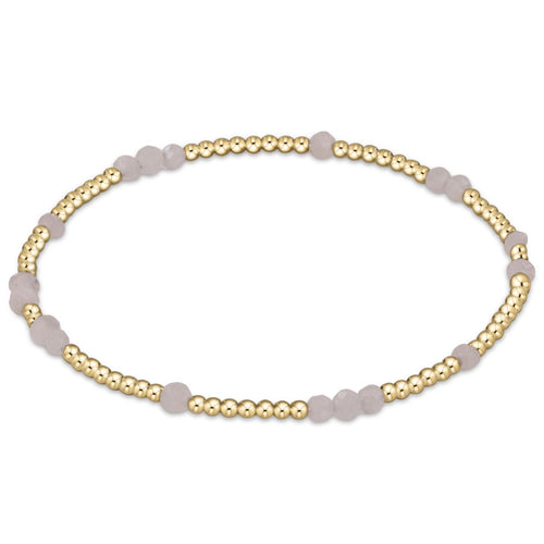 enewton Hope Unwritten Gemstone Bracelet – moonstone 3 mm gemstones with 2 mm gold‑filled beads on stretch elastic. Worry‑free wear (sleep, shower, sweat). Stackable style. Available at Be Charmed