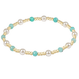 Gold bracelet with pearls and amazonite beads on a white background. Available at Be Charmed