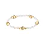 Pearl and gold bracelet on a white background. Available at Be Charmed