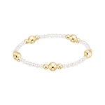 Bracelet with alternating gold and pearl beads on a white background. Available at Be Charmed