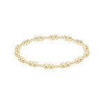 Gold beaded bracelet on a white background. Available at Be Charmed