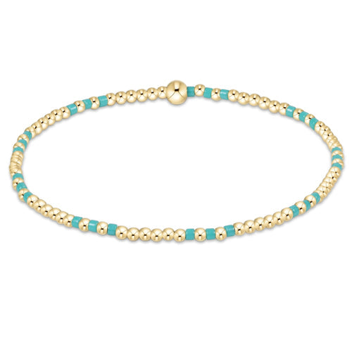 enewton Hope Joy Pattern 2mm Bead Bracelet in Turquoise with 14k gold-filled and turquoise beads. Stretchy, water-friendly, and stackable. Available at Be Charmed.
