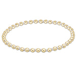 enewton Hope Grateful Bracelet – white 2mm seed beads alternating with 2mm 14kt gold-filled beads on stretch elastic. Worry-free wear—sleep, shower, sweat. Stackable elegance. Available at Be Charmed