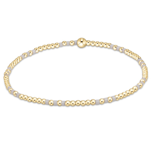 enewton Hope Joy bracelet with 2mm white beads in a light, joyful pattern; elegant, minimalist, and stretch-fit. Available at Be Charmed.