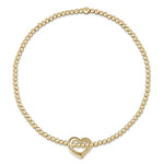 enewton A gold-filled bracelet with a chain of beads and a gold-filled heart-shaped charm. Available at Be Charmed