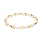 enewton extend together Gold and silver beaded bracelet on a white background. Available at Be Charmed