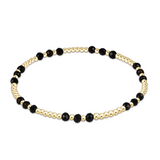 enewton Gemstone Gold Joy Pattern 3mm Bead Bracelet in Faceted Onyx—black gemstone stacking bracelet with gold accents. Available at Be Charmed
