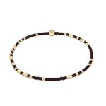 enewton Hope Unwritten Bracelet in Chocolate with gold and black beads on a white background. Available at Be Charmed
