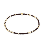 enewton Hope Unwritten Bracelet in Chocolate with gold and black beads on a white background. Available at Be Charmed