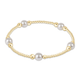 Gold and pearl bracelet on a white background. Available at Be Charmed