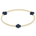 enewton Gold bracelet with navy blue cross charms on a white background. Available at Be Charmed
