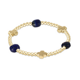 enewton Signature Cross Admire Gold Pattern 3mm Bead Bracelet in Lapis—faith-inspired blue gemstone stacking bracelet with gold cross. Available at Be Charmed