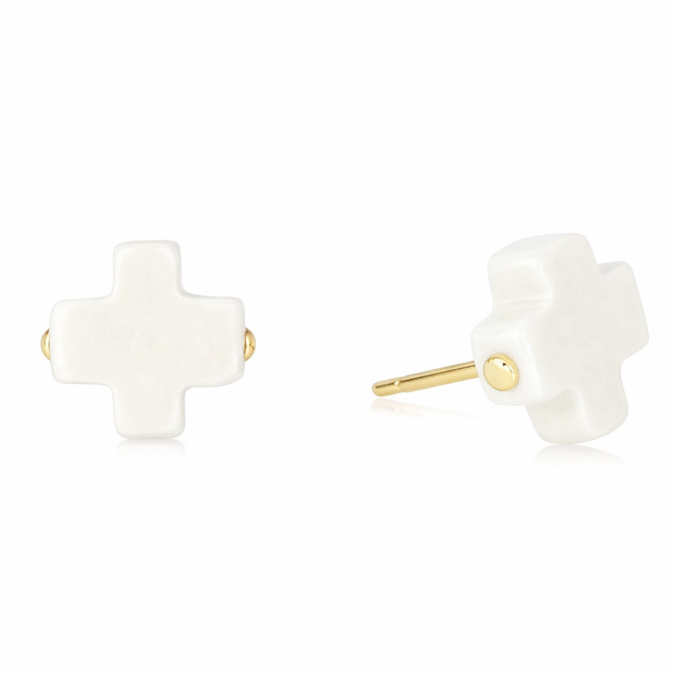enewton Off White cross-shaped earrings with gold posts on a white background. Available at Be Charmed