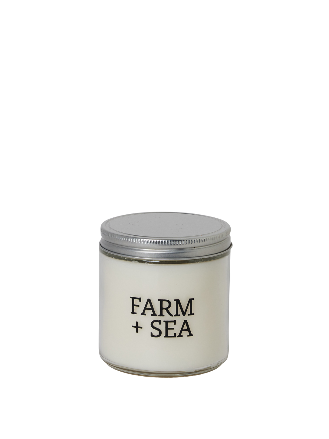 Candle jar with 'Farm + Sea' branding on a white background. Available at Be Charmed