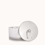 Thymes Frasier Fir Flocked 3-Wick Poured Candle with festive pine fragrance and decorative flocked exterior. Available at Be Charmed.