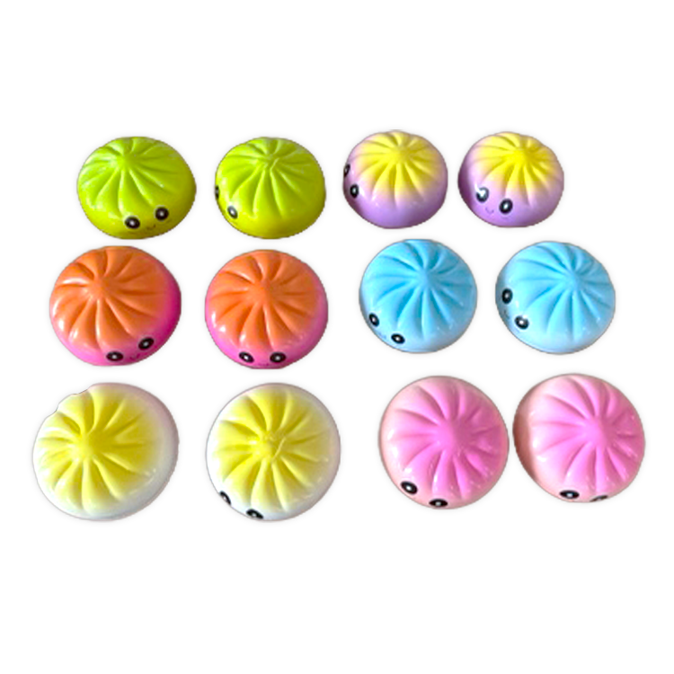 Variety of squish dumplings with faces on a white background. Available at Be Charmed