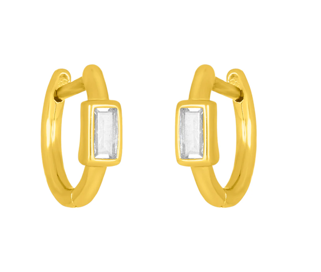 A pair of gold-colored fyb Brynn Baguette Huggie Earrings with clear stones set in silver. Available at Be Charmed