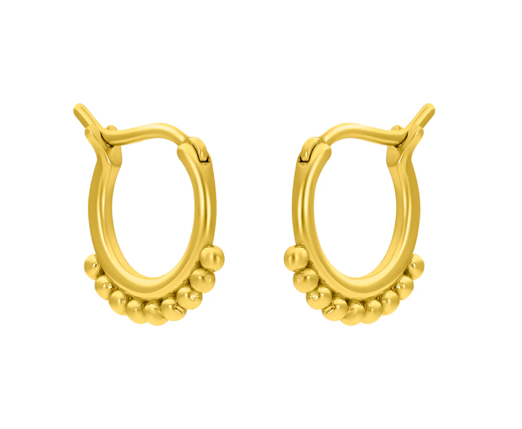 A pair of gold-plated huggie earrings with a textured design. Available at Be Charmed
