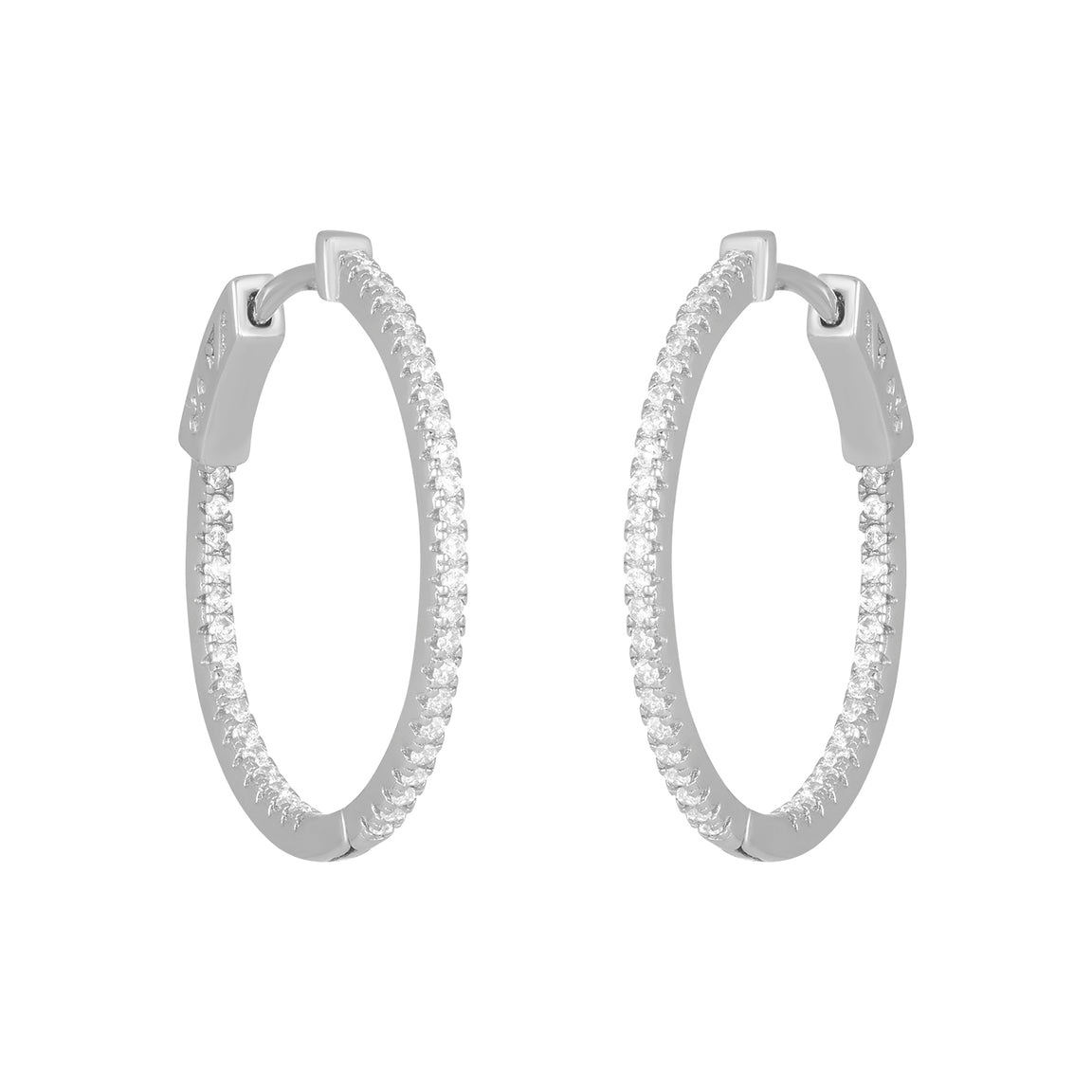 A pair of silver-colored hoop earrings with intricate detailing, designed to be stylish and elegant. Available at Be Charmed