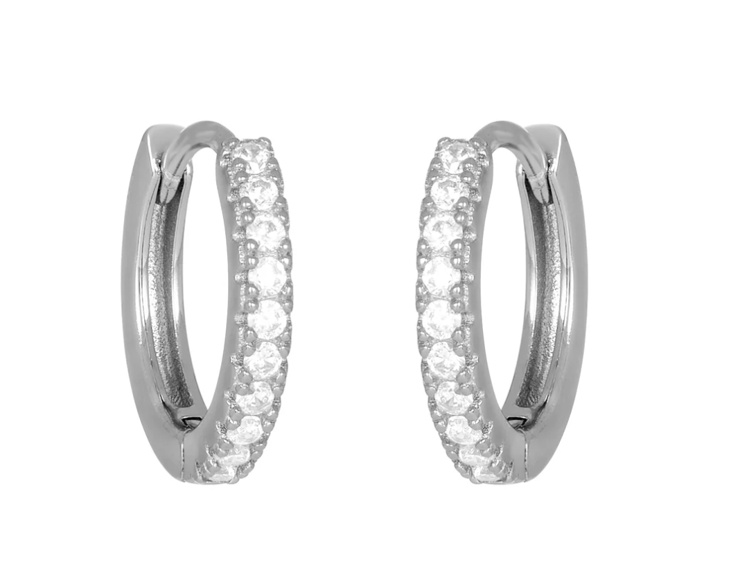 Silver fyb Petite Blythe Huggie Earrings in sterling silver with sparkling cubic zirconia accents. Dainty, elegant hoops for daily wear. Available at Be Charmed.