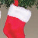 Small red and white Gerson Christmas stocking hanging on a tree branch. Available at Be Charmed. 