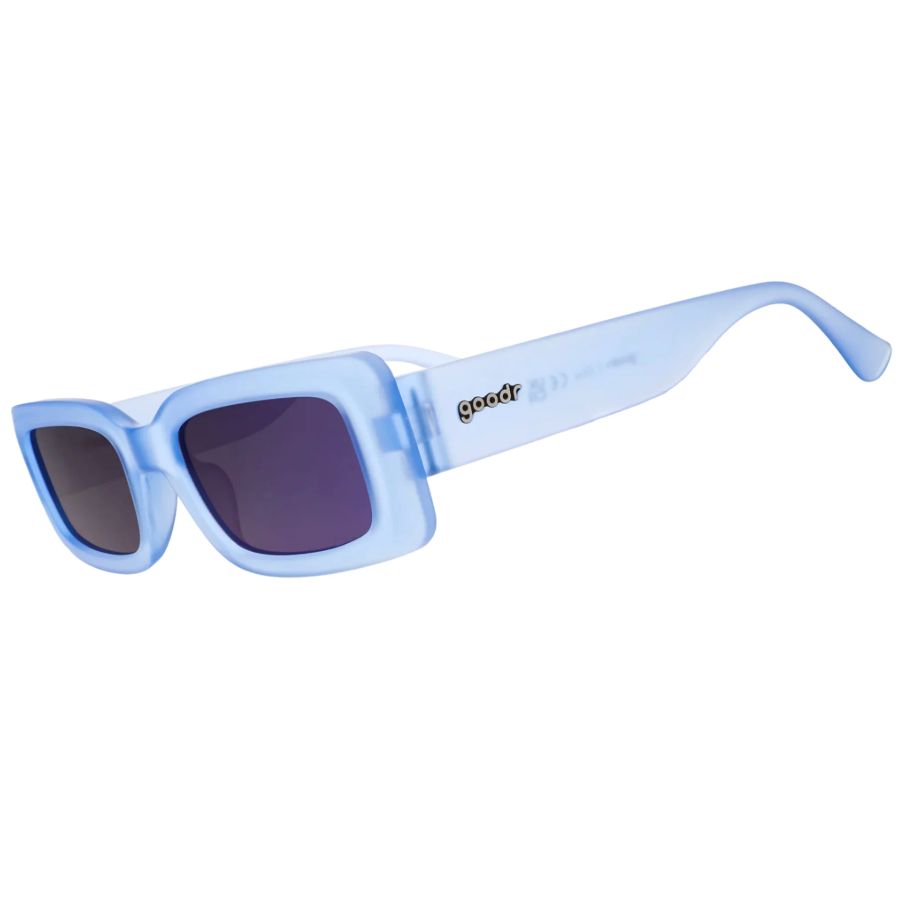 Blue sunglasses with a brand logo on a white background. Available at Be Charmed.