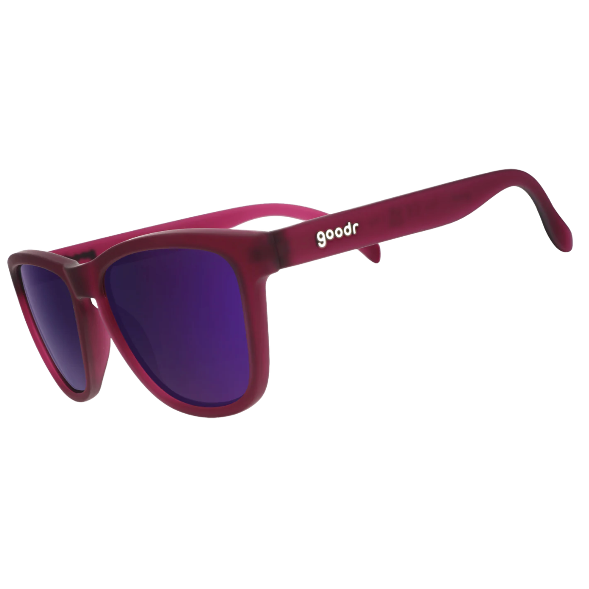 Red sunglasses with purple lenses on a white background. Available at Be Charmed