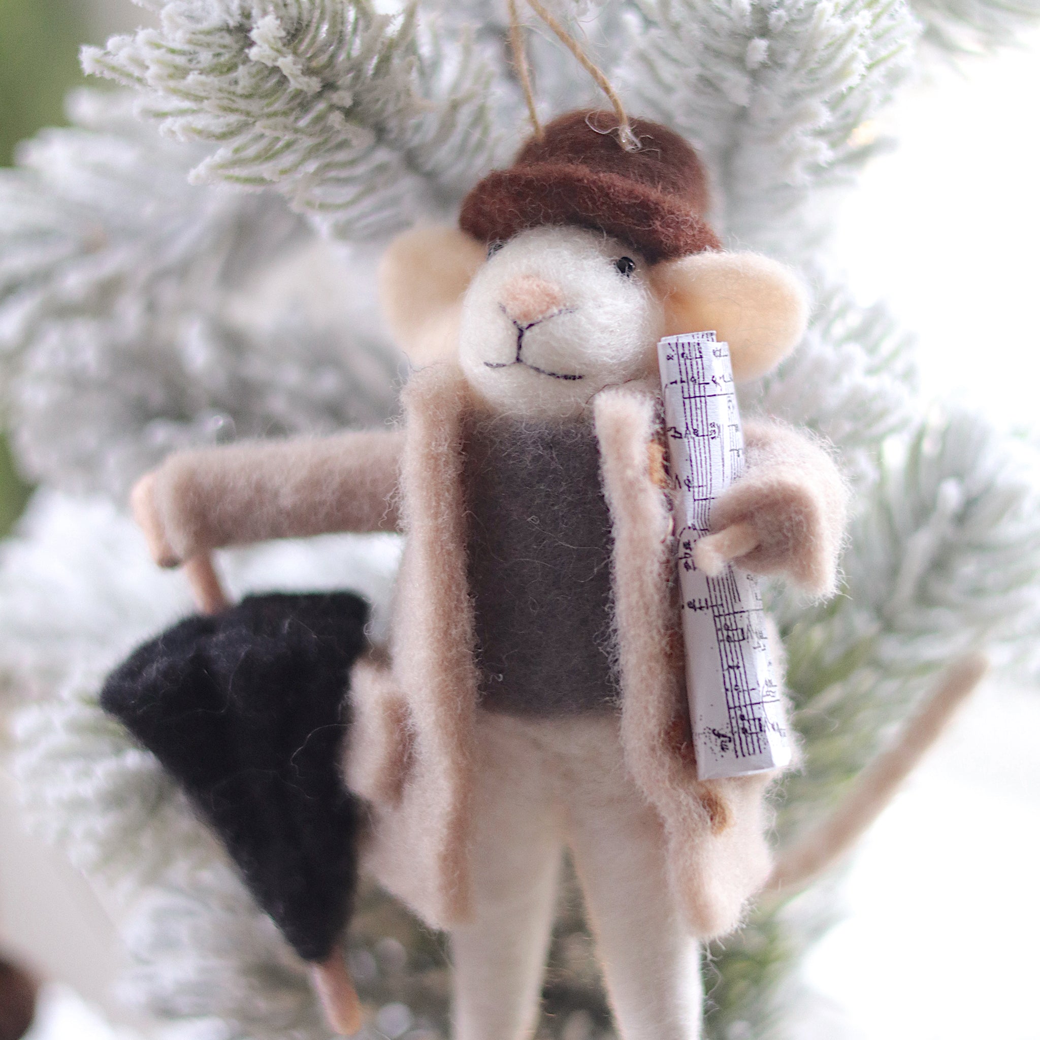 Plush mouse ornament with a hat and scarf on a Christmas tree. Available at Be Charmed