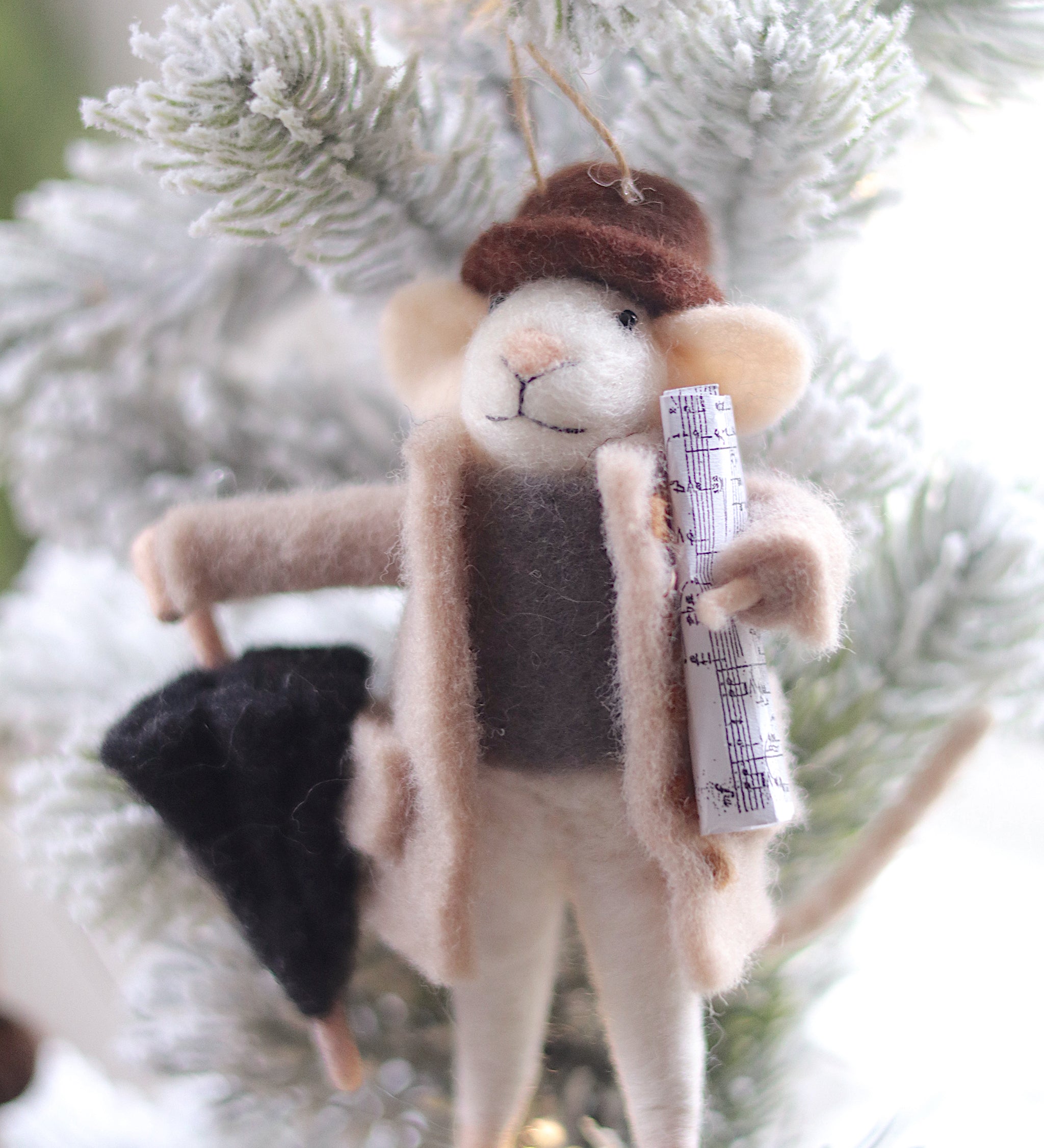 Plush mouse ornament with a hat and scarf on a Christmas tree. Available at Be Charmed