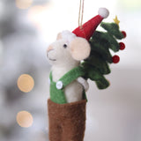 Decorative mouse ornament with a Santa hat and Christmas tree, hanging against a blurred festive background. Available at Be Charmed