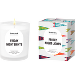 Homesick 'Friday Night Lights' candle and packaging on a white background. Nostalgic fresh fragrance inspired by game day. Available at Be Charmed.